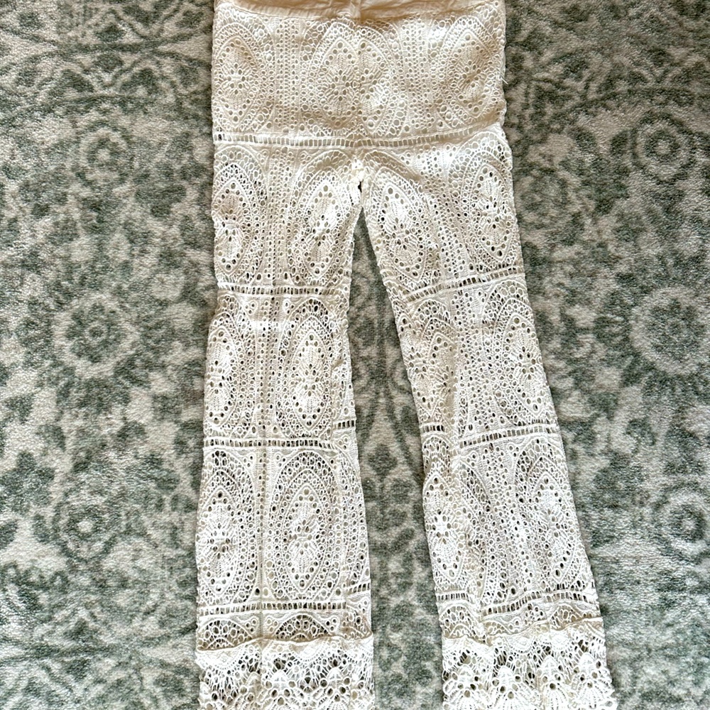 Eyelet pants. Shorts on top, can wear over bathing suit or as pants